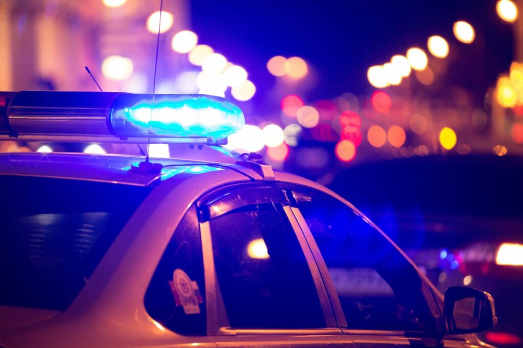 Police car sirens at night